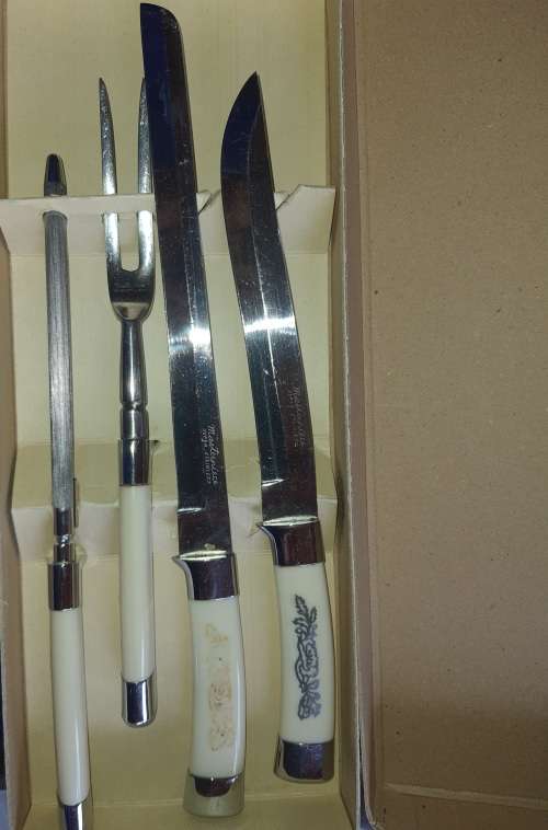 A 4 PIECE CARVING SET WITH WHITE INLAID HANDLE  MASTER PIECE STAINLESS STEEL