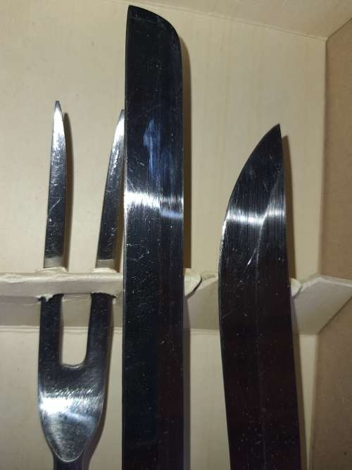 A 4 PIECE CARVING SET WITH WHITE INLAID HANDLE  MASTER PIECE STAINLESS STEEL