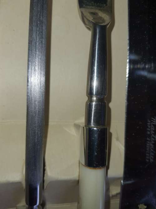 A 4 PIECE CARVING SET WITH WHITE INLAID HANDLE  MASTER PIECE STAINLESS STEEL