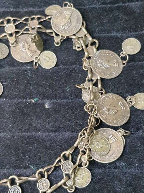 A VINTAGE ORNATE COIN BRONZE NECKLACE WITH 2 COINS LOOSE SOLD AS IS