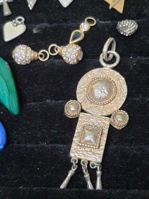 A VINTAGE COLLECTION OF PENDANTS SOLD AS IS