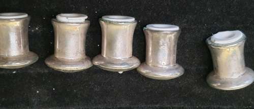 A VINTAGE COLLECTUON OF EPNS MINITURE SALT AND PEPPER DISPENSORS