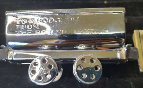A VINTAGE ORNAMENTAL MINING CARRIAGE DESK TOP AND 2 GENTLEMENS MONEY CLIPS STAINLESS TEEEL SOLD AS