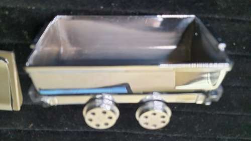 A VINTAGE ORNAMENTAL MINING CARRIAGE DESK TOP AND 2 GENTLEMENS MONEY CLIPS STAINLESS TEEEL SOLD AS