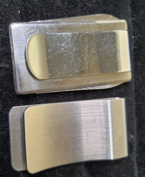 A VINTAGE ORNAMENTAL MINING CARRIAGE DESK TOP AND 2 GENTLEMENS MONEY CLIPS STAINLESS TEEEL SOLD AS