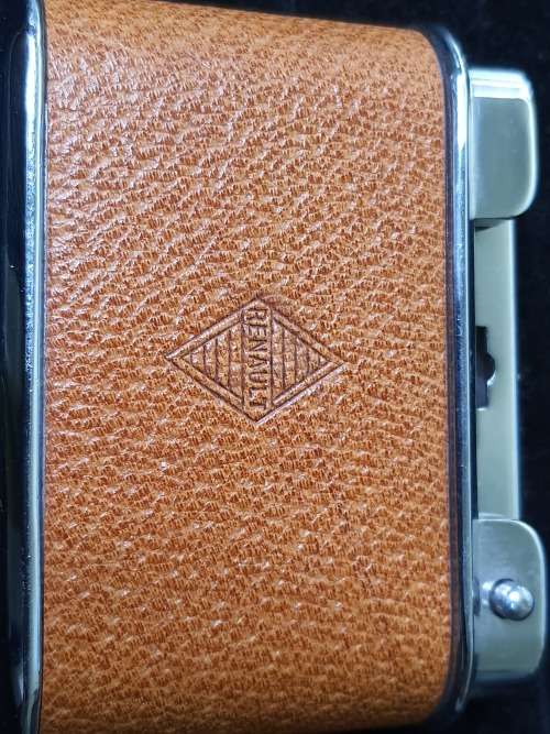 A RENAULT CIGGARETTE LIGHTER SOLD AS IS