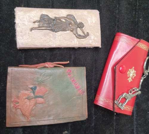 A COLLECTION OF COLLECTABLE ITEMS DAIRIES AND KEY RINGS SOLD AS IS