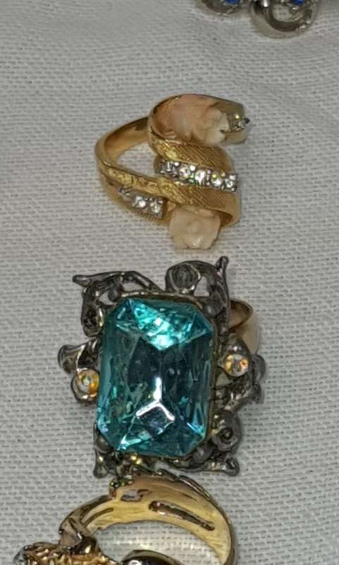 A VINTAGE COLLECTION OF DRESS RINGS SOLD AS IS