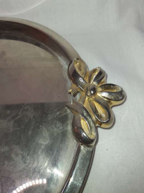A VINTAGE STAINLESS STEEL WITH GOLD TONE HANDLES SERVING TRAY SOLD AS IS