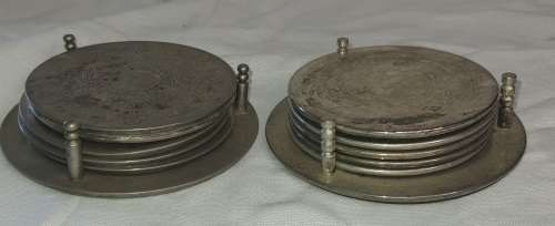 TWO VINTAGE SETS OF COASTERS FOR THE BAR SILVER PLATED AND ORIGINAL CONDITION SOLD AS IS
