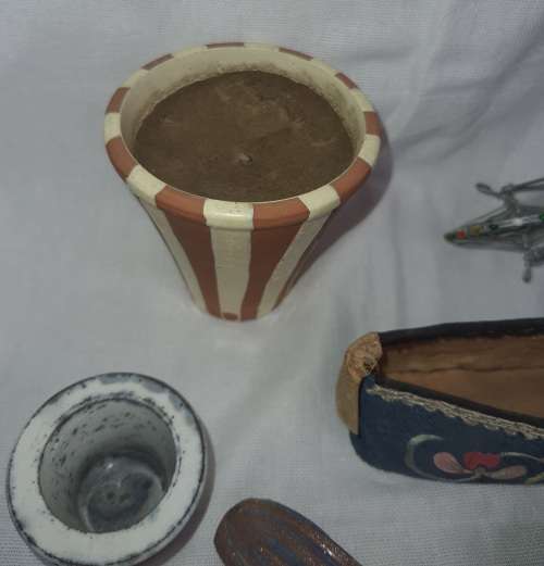 A VINTAGE COLLECTION OF MINITURE MIXED FIGURINES SOLD AS IS