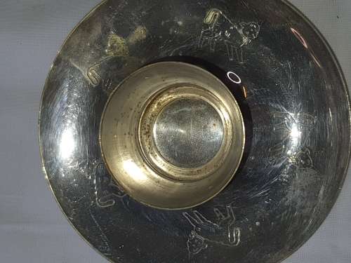 A SILVER PLATED VINTAGE CANDLE HOLDER SOLD AS IS