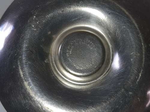 A SILVER PLATED VINTAGE CANDLE HOLDER SOLD AS IS