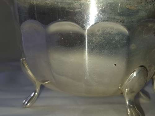 A VINTAGE SILVER PLATED SAUCE BOAT AND LADEL SOLD AS IS
