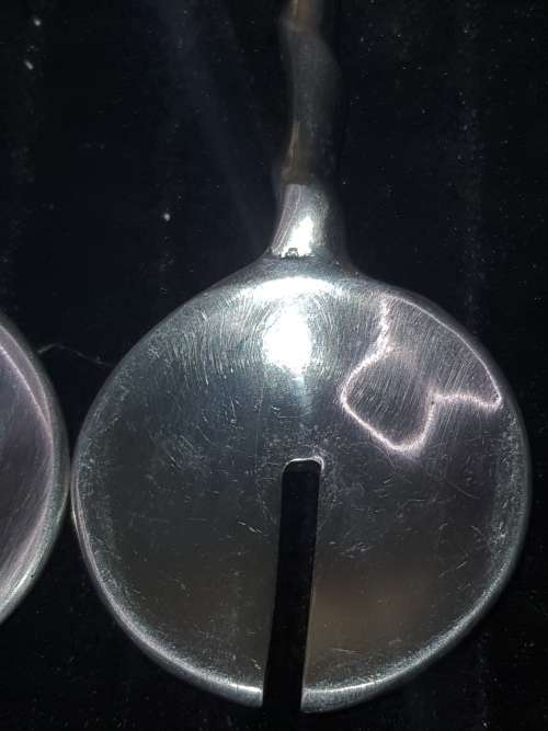 A SET OF VINTAGE STAINLESS STEEL SALAD SPOONS SOLD AS IS