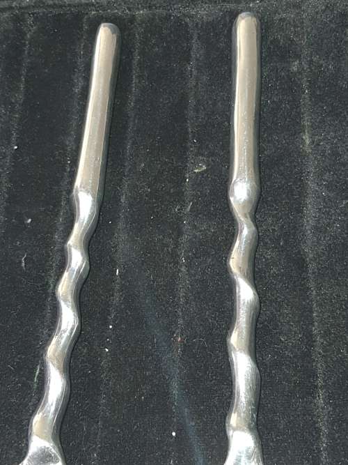A SET OF VINTAGE STAINLESS STEEL SALAD SPOONS SOLD AS IS