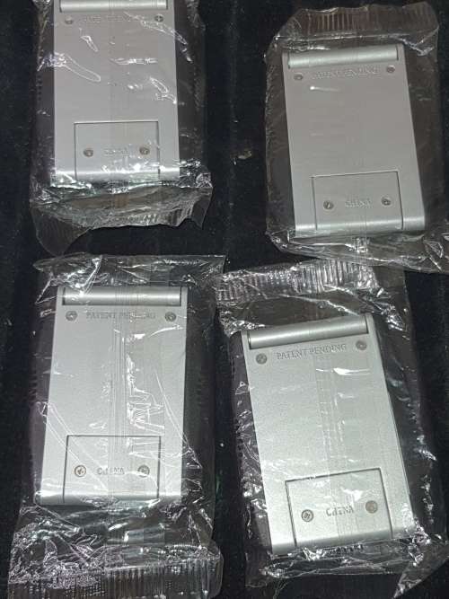 A JOBLOT POCKET CALCULATORS IN ITS PLASTIC PACKAGING NEVER BEEN USED SOLD AS IS