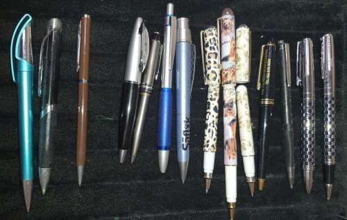 A COLLECTION JOBLOT ROLLER BALL PENS AND PENCILS SOLD AS IS NOT TESTED