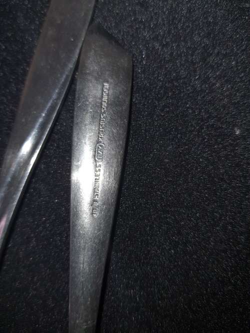A VINTAGE SET OF FISH KNIVES AND FORKS MADE BY KRIIUS SOLINGEN SOLD AS IS