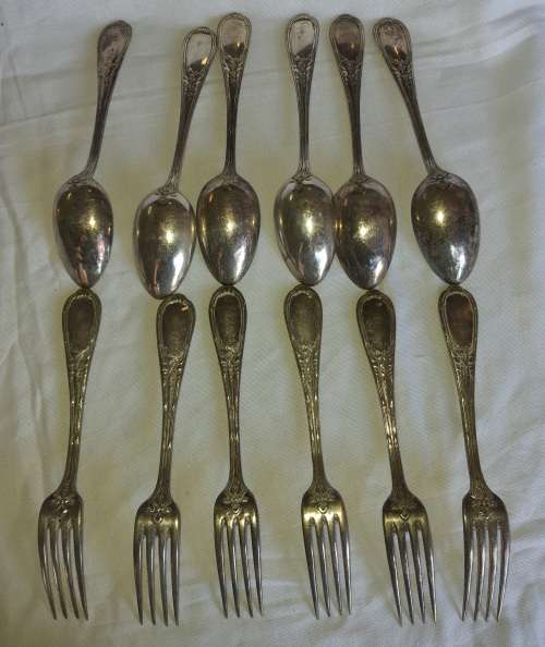 A SET OF VINTAGE SPOONS AND FORKS STAMPED GERP K 100 SOLD AS IS