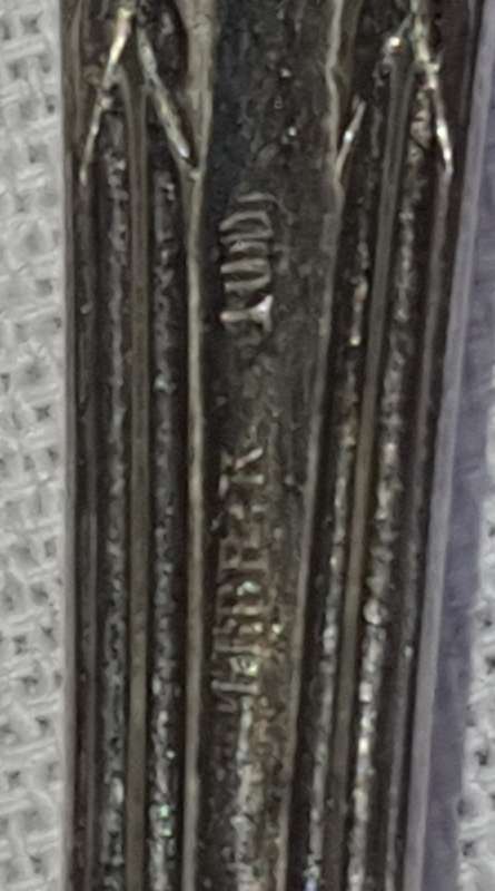 A SET OF VINTAGE SPOONS AND FORKS STAMPED GERP K 100 SOLD AS IS