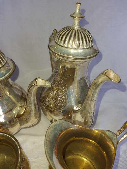A VINTAGE EPNS ORNATE TEA SET SOLD AS IS