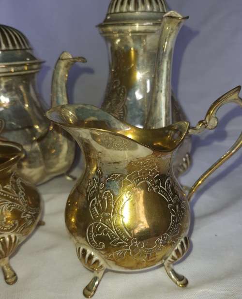 A VINTAGE EPNS ORNATE TEA SET SOLD AS IS