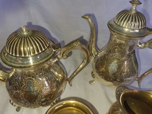 A VINTAGE EPNS ORNATE TEA SET SOLD AS IS
