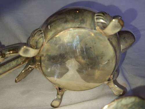 A VINTAGE EPNS ORNATE TEA SET SOLD AS IS