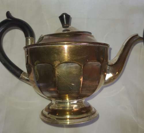 A VINTAGE EPNS SILVER PLATED TEA SET SOLD AS IS