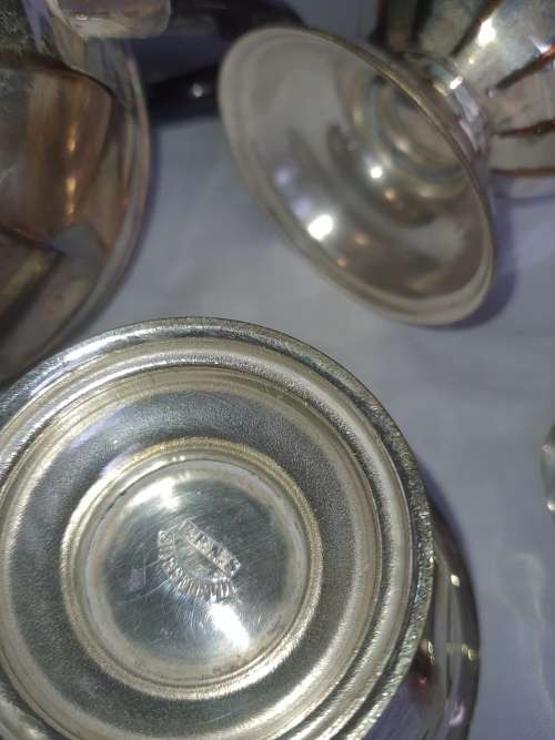 A VINTAGE EPNS SILVER PLATED TEA SET SOLD AS IS