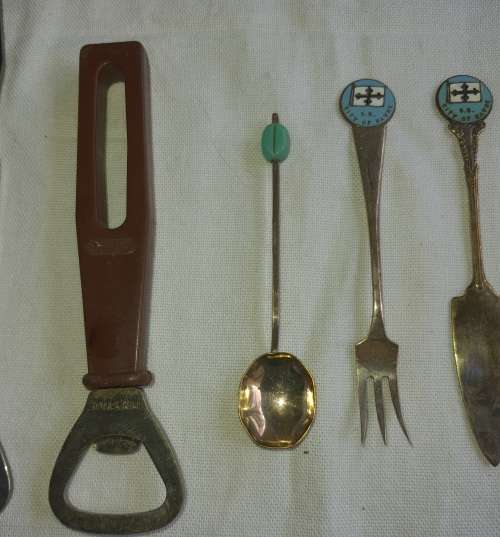 A VINTAGE COLLECTION OF BOTTLE OPENERS