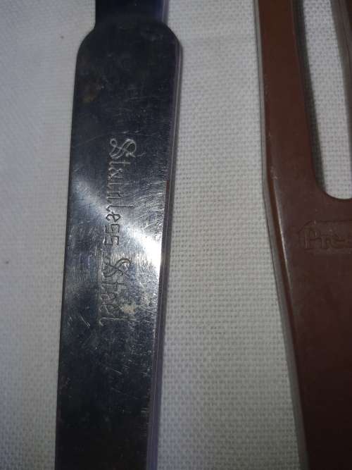 A VINTAGE COLLECTION OF BOTTLE OPENERS