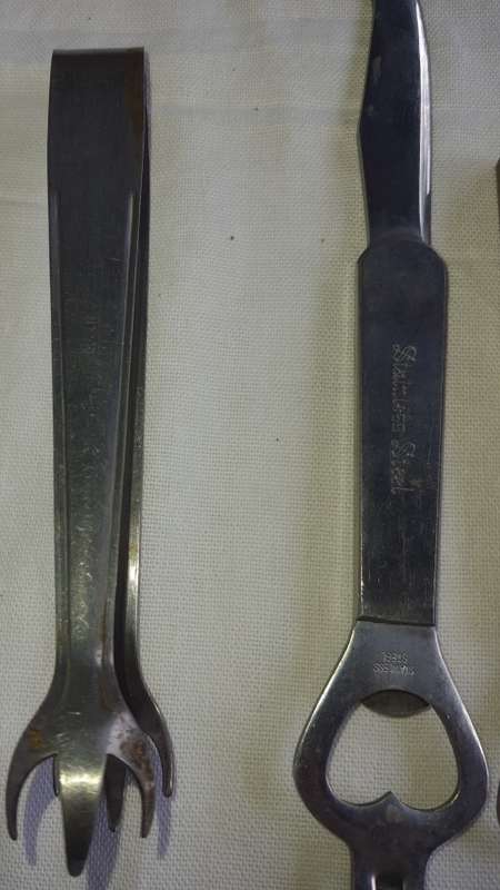 A VINTAGE COLLECTION OF BOTTLE OPENERS