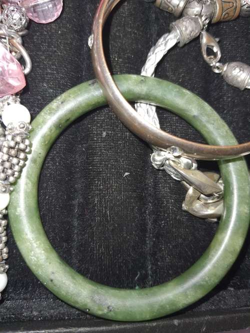 A VINTAGE COLLECTION OF BANGLES AND BRACELETS SOLD AS IS