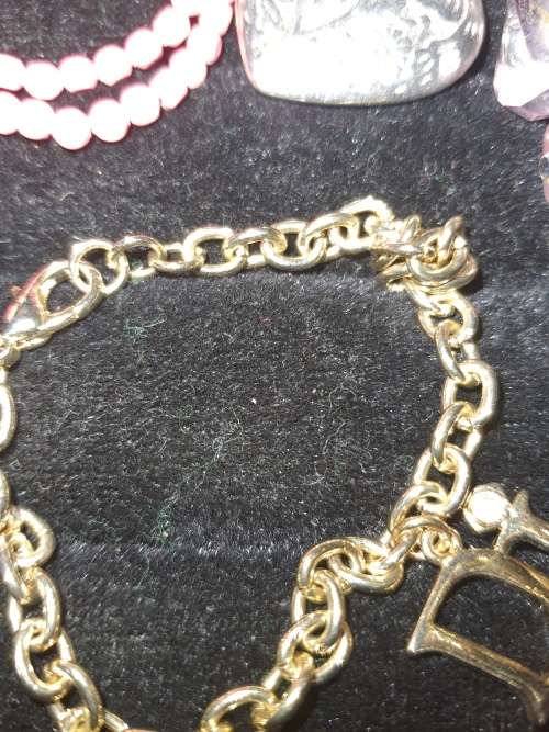 A VINTAGE COLLECTION OF BANGLES AND BRACELETS SOLD AS IS