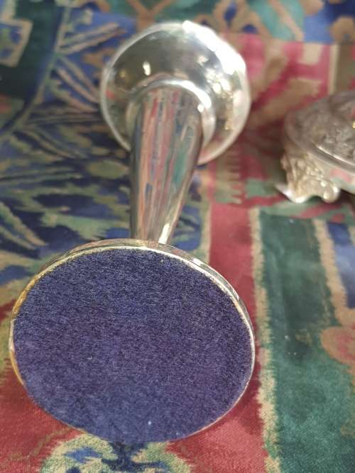 TWO VINTAGE EPNS OR SILVER PLATED VASE AND A ORNATE CANDLE STAND SOLD AS IS