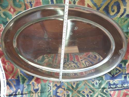 AN EXTRA LARGE STAINLESS STEEL OVAL SERVING TRAY