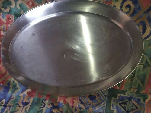 AN EXTRA LARGE STAINLESS STEEL OVAL SERVING TRAY