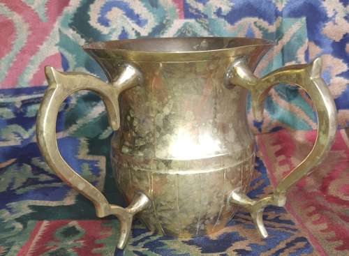 A VINTAGE BRONZES BOUBLE HANDLED WATER OR BEER JUG