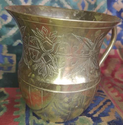 A VINTAGE BRONZES BOUBLE HANDLED WATER OR BEER JUG