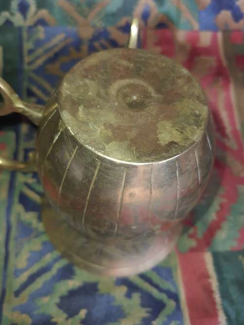 A VINTAGE BRONZES BOUBLE HANDLED WATER OR BEER JUG