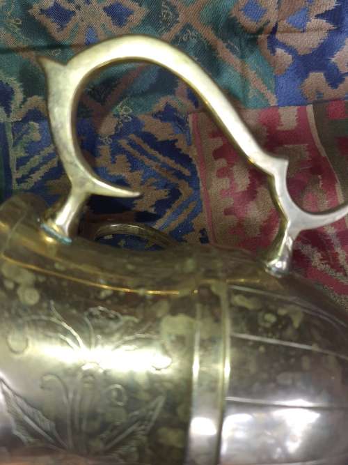 A VINTAGE BRONZES BOUBLE HANDLED WATER OR BEER JUG