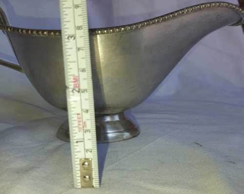 A VINTAGE ALUMINIUM ALLOY SAUCE JUG IN GOOD CONDITION SOLD AS IS