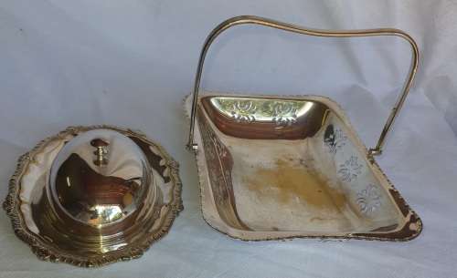 TWO VINTAGE SILVER PLATED ITEMS A BUTTER BOWL WITH A LID AND A SERVING BASKET SOLD AS IS