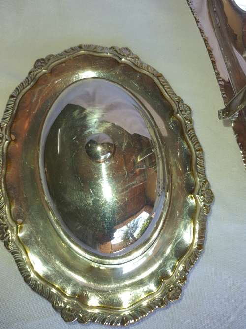 TWO VINTAGE SILVER PLATED ITEMS A BUTTER BOWL WITH A LID AND A SERVING BASKET SOLD AS IS