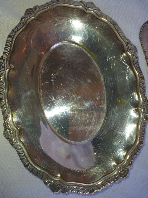 TWO VINTAGE SILVER PLATED ITEMS A BUTTER BOWL WITH A LID AND A SERVING BASKET SOLD AS IS