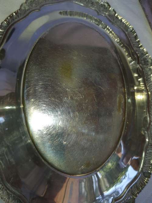 TWO VINTAGE SILVER PLATED ITEMS A BUTTER BOWL WITH A LID AND A SERVING BASKET SOLD AS IS