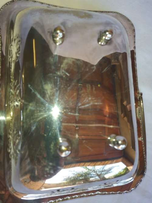 TWO VINTAGE SILVER PLATED ITEMS A BUTTER BOWL WITH A LID AND A SERVING BASKET SOLD AS IS