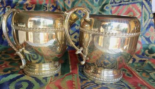 A SET OF TWO VINTAGE SILVER PLATED ROMAN STYLE JUGS